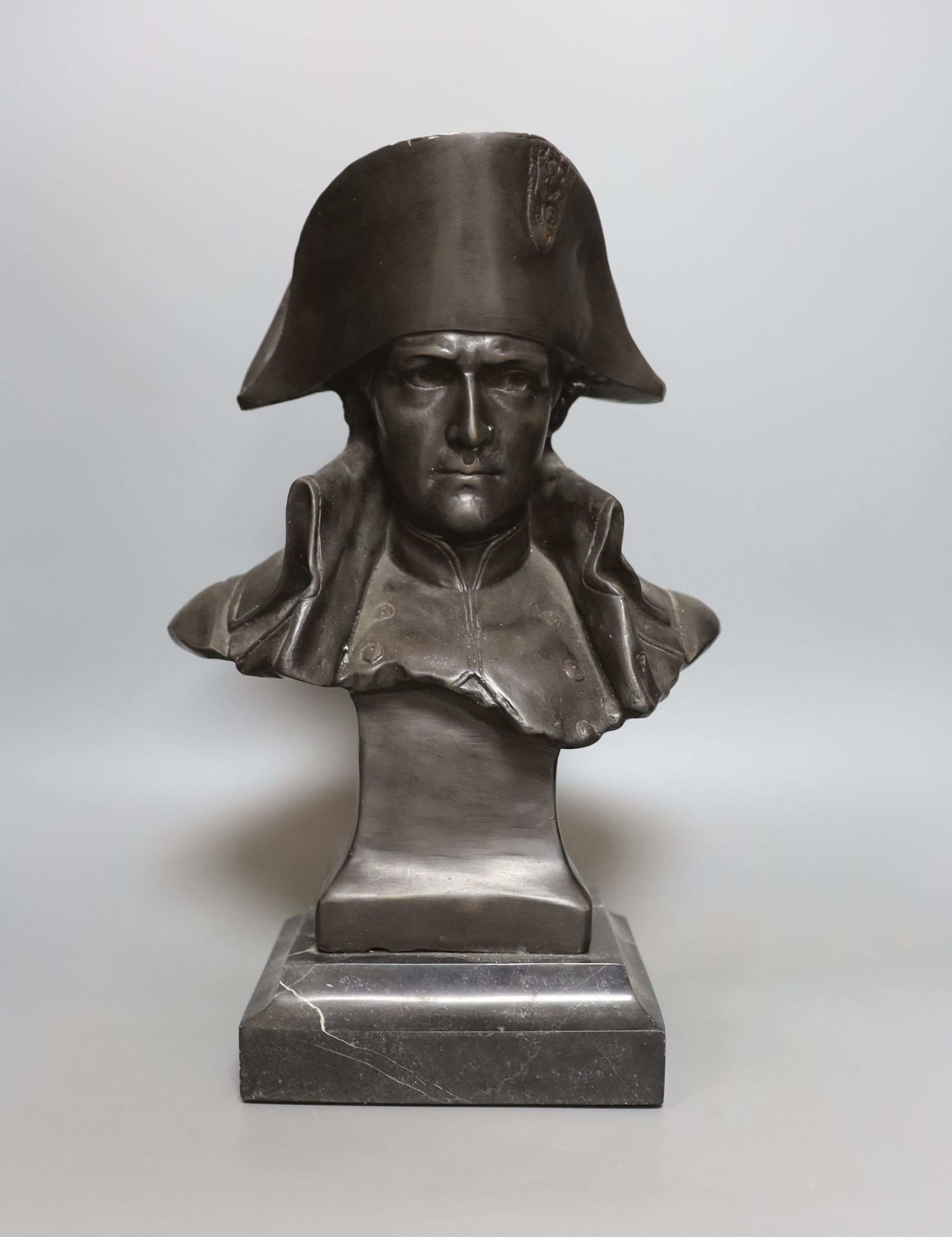 A bronze portrait bust of Napoleon, bearing script mark verso Lecomte 82, on marble plinth, 36cm